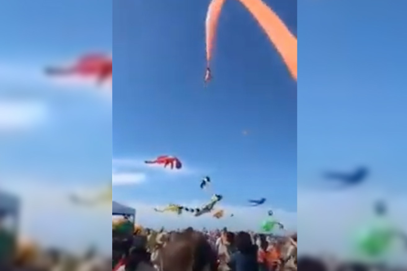 The girl was thrown high in the air, trapped in the kite's tail.
