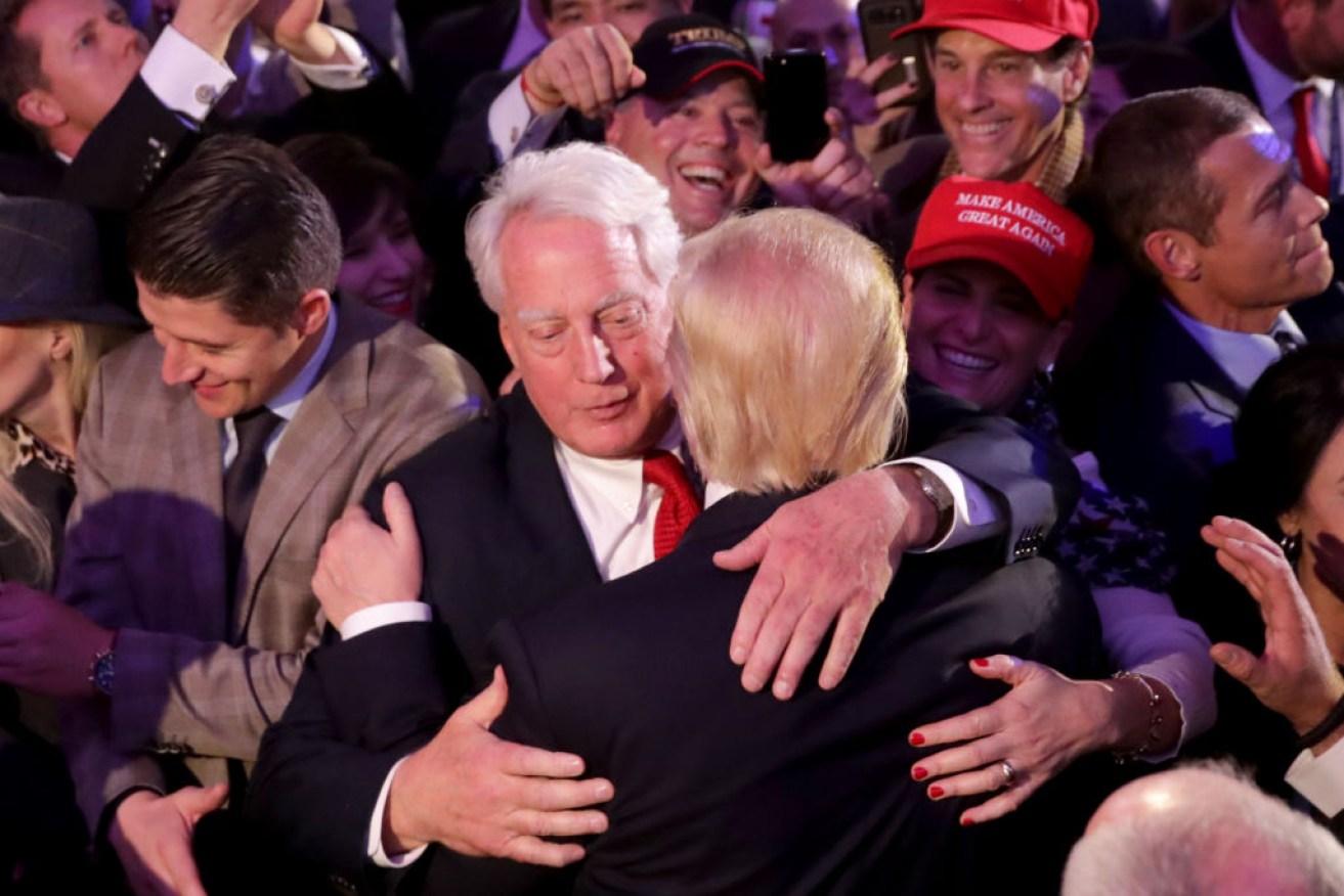 Donald Trump hugs his brother Robert on the night he was elected president. 