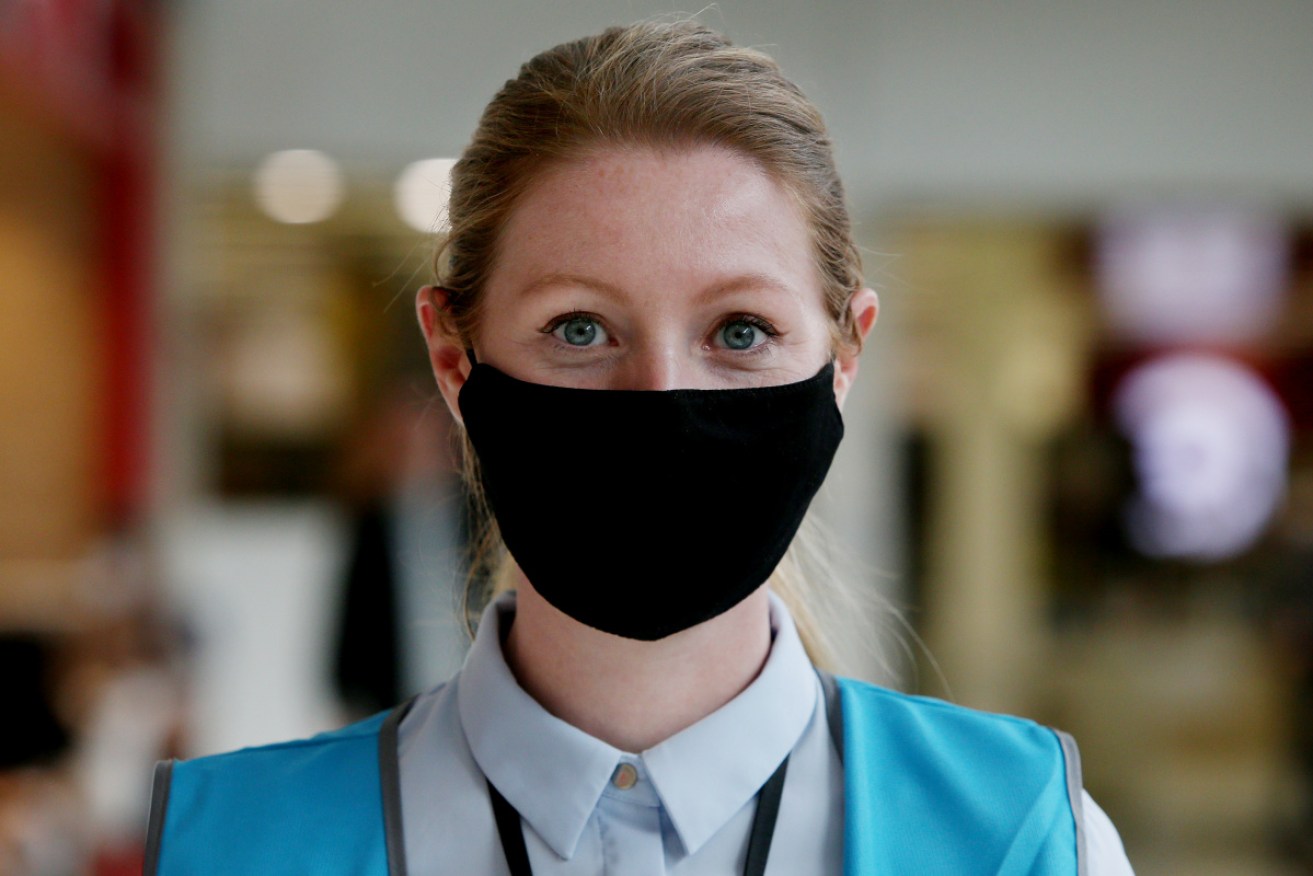 Kitty Ruce at work at a Sydney shopping centre – wearing a mask.