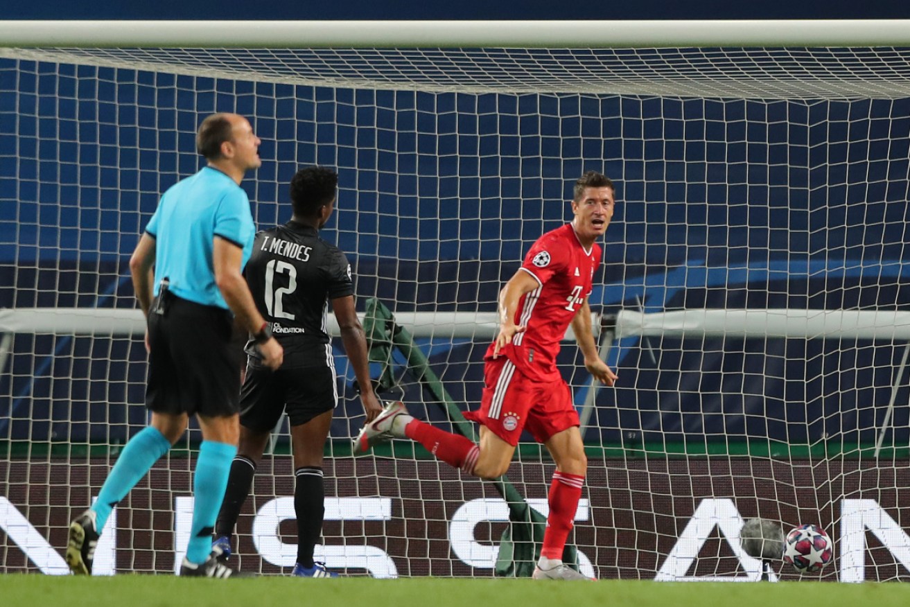 Robert Lewandowski of Bayern Munich celebrates after scoring his team's third goal against Lyon.