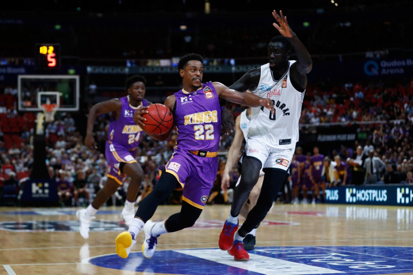 Melbourne United’s Jo Lual Acuil, right, was one of the first two NBL players to test positive. 