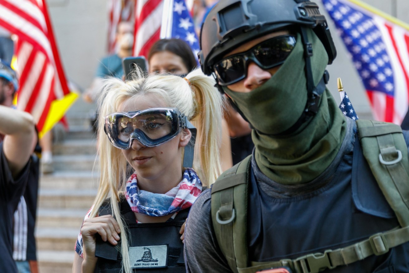 Right-wing demonstrator Haley Adams joins the Proud Boys briefly at Portland, Oregon’s Justice Centre. 