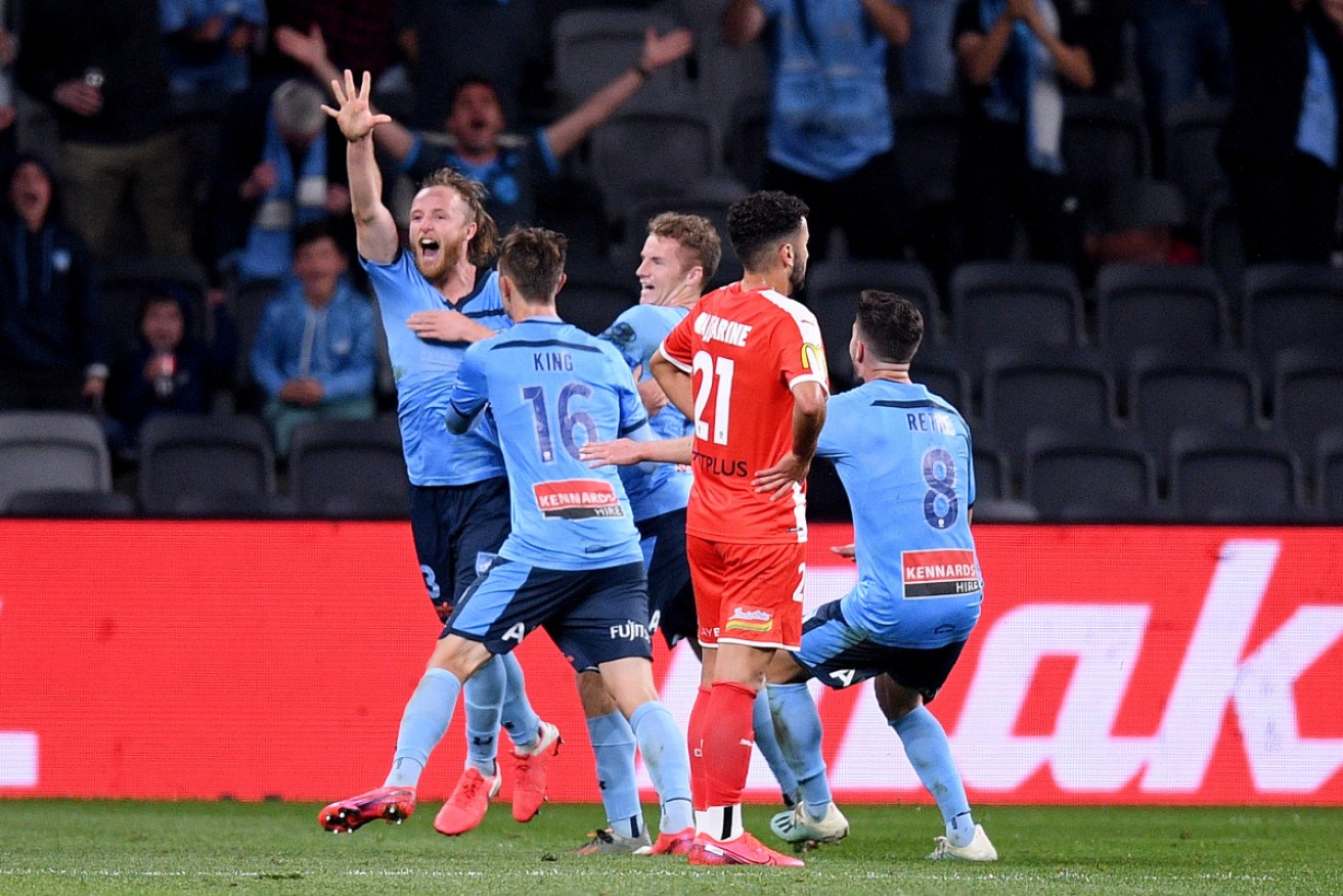 Rhyan Grant enjoys his extra-time goal that handed Sydney FC the grand final win.