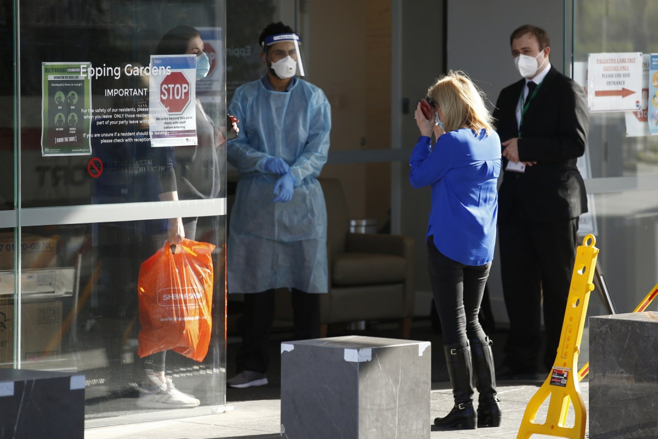 A distressed relative of a resident outside the Epping Gardens aged-care home in Melbourne last week.