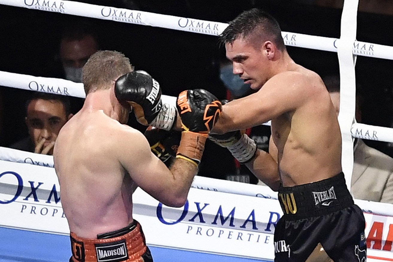 Tim Tsyzu gets of top of fellow Australian Jeff Horn in Townsville on Wednesday night.