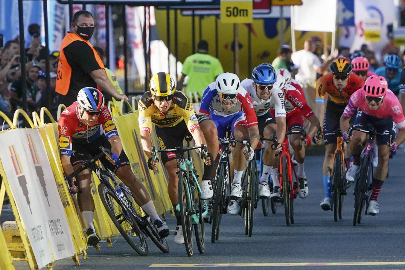 Fabio Jakobsen hits the side barriers alongside Dylan Groenewegen in the opening-stage sprint finish at Katowice. Photo: AP