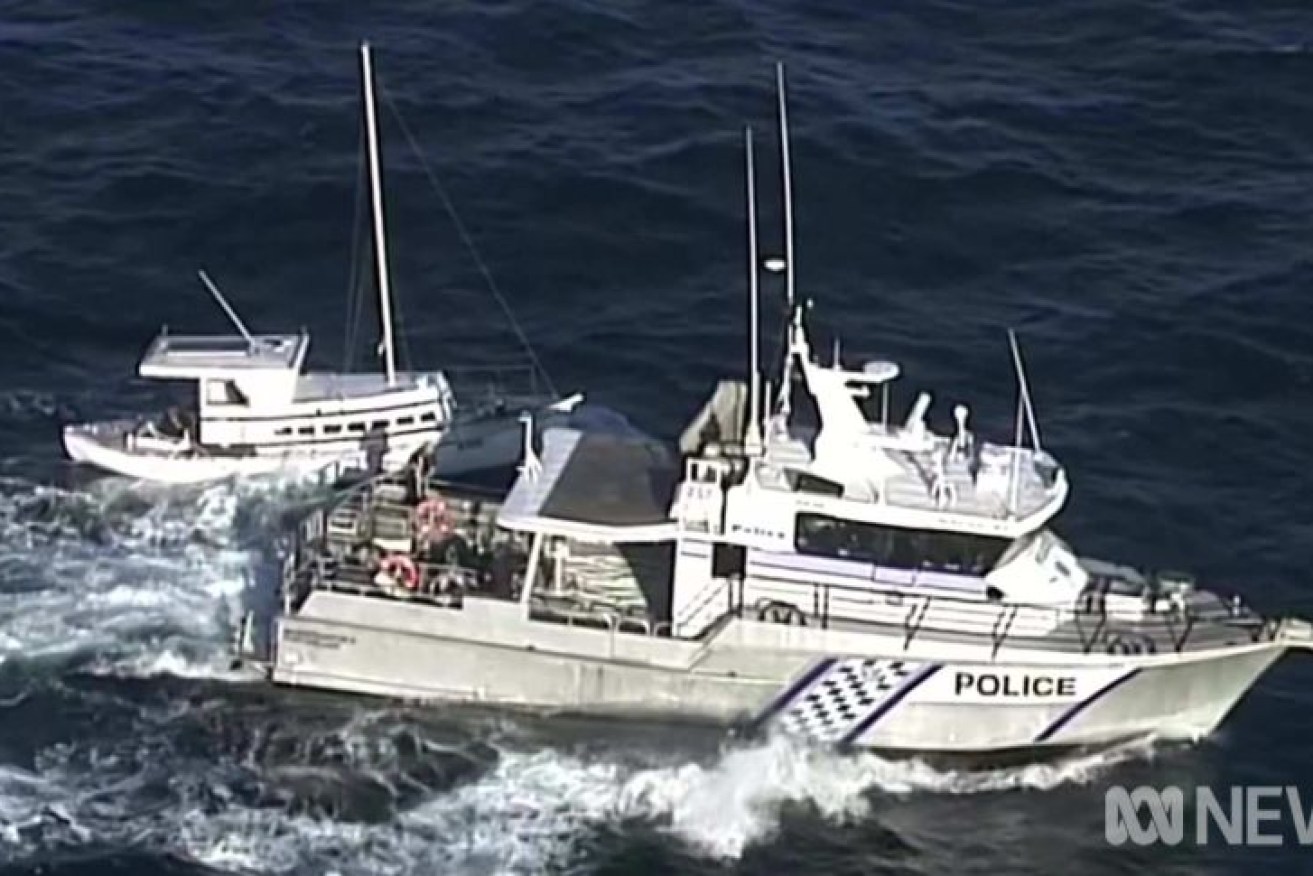 A South Australian police launch alongside the Margrel, with Tony Higgins and Derek Robinson on board.