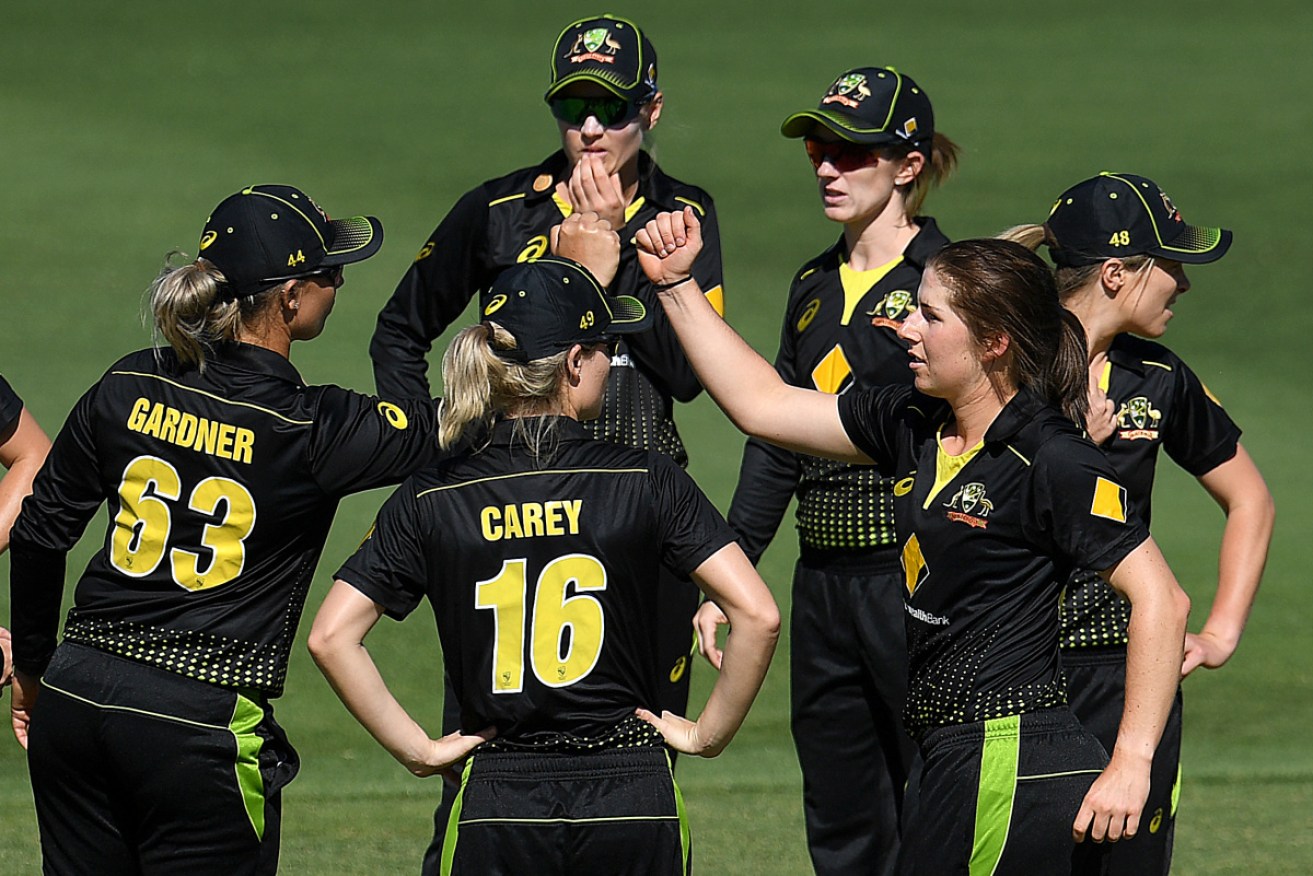 Georgia Wareham (right) celebrates dismissing NZ’s Hayley Jensen at Allan Border Field in Brisbane on Sunday.