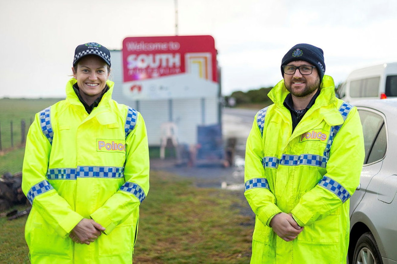 South Australian police officers Lauren Foote and Matthew Jose on the SA border.