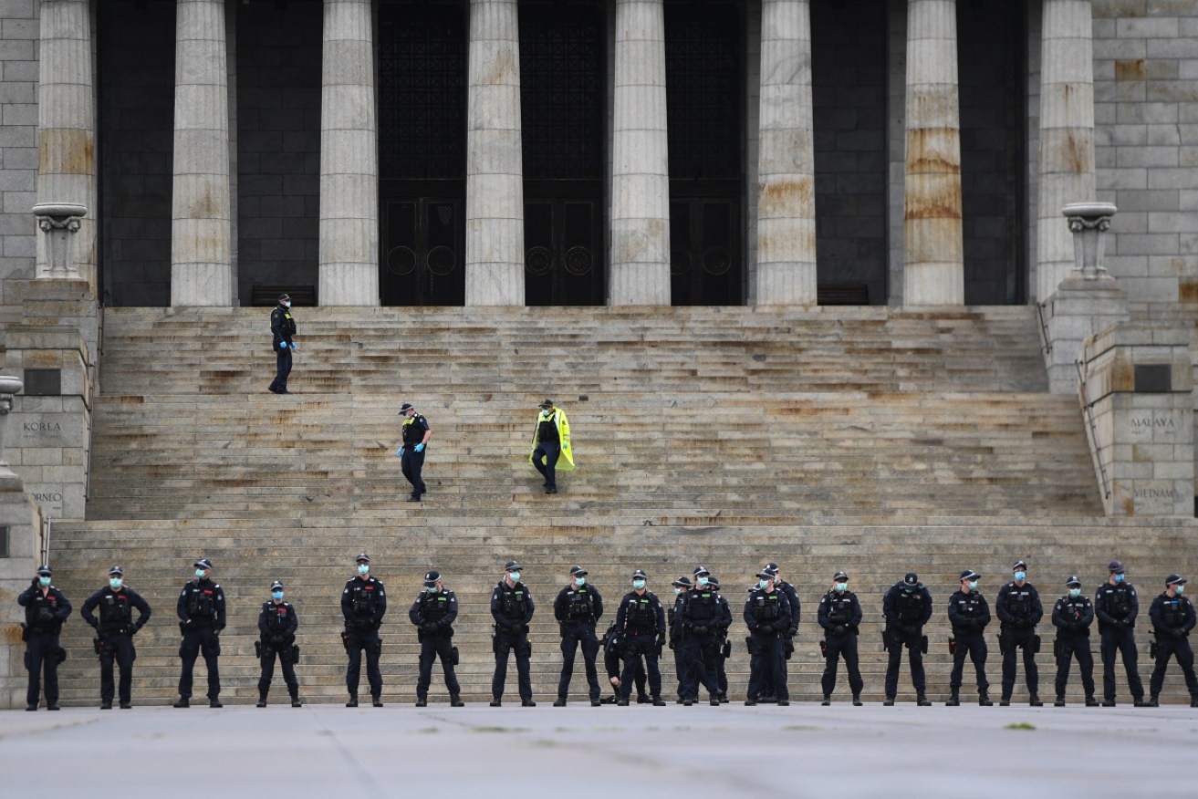 Police form a line around the Shrine of Remembrance in Melbourne. 