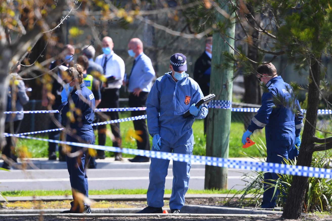 Officers at the scene of Tuesday's police shooting in Melbourne's outer east.