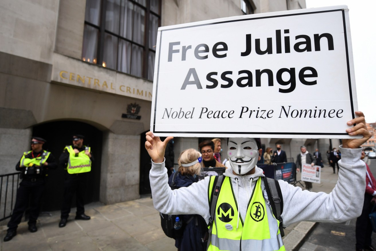 Demonstrators protest in support of WikiLeaks founder Julian Assange outside the Old Bailey in London on Monday.