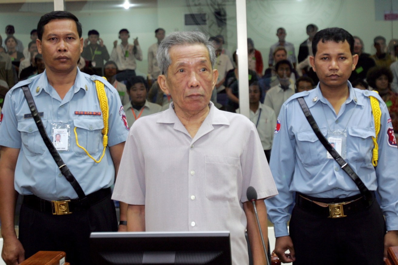 Kaing Guek Eav, alias 'Duch', stands in the court room in Phnom Penh, Cambodia in December 2008.
