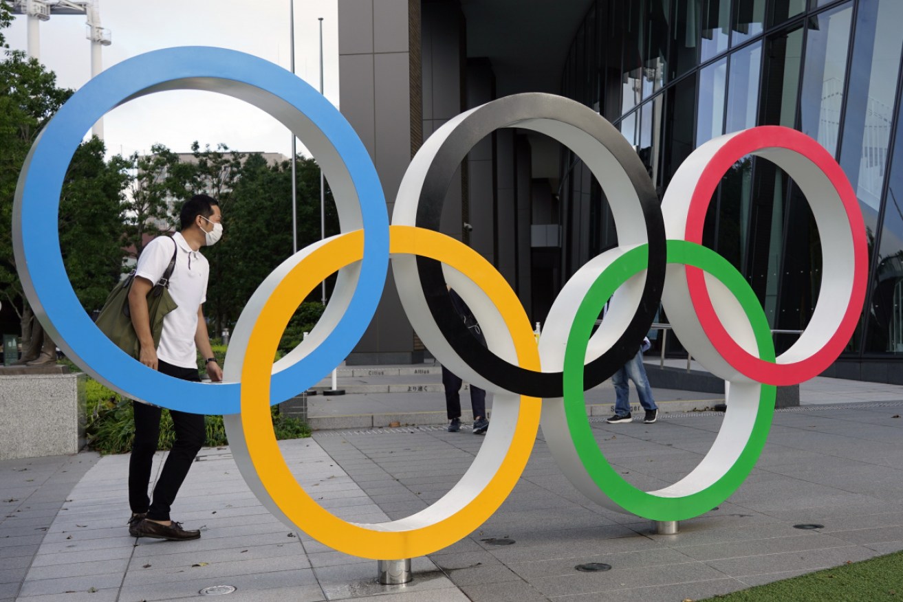 The Olympic Rings monument in Tokyo, with corornvirus masks.