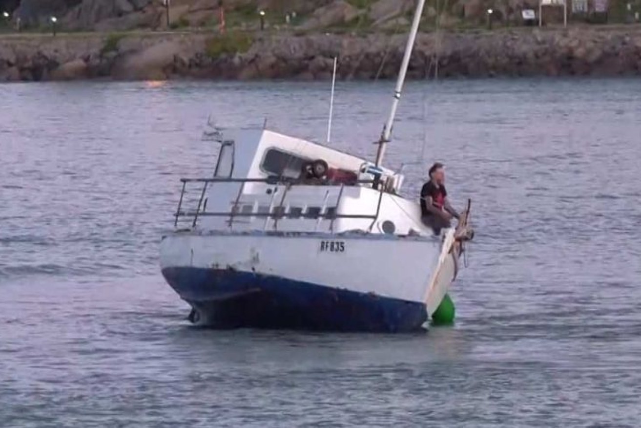 Tony Higgins on his boat Margrel after it ran aground off Granite Island on Saturday.