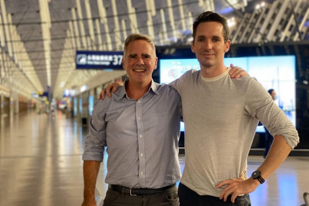 The Australian Financial Review's Michael Smith (left) and the ABC's Bill Birtles flew out of Shanghai on Monday night.