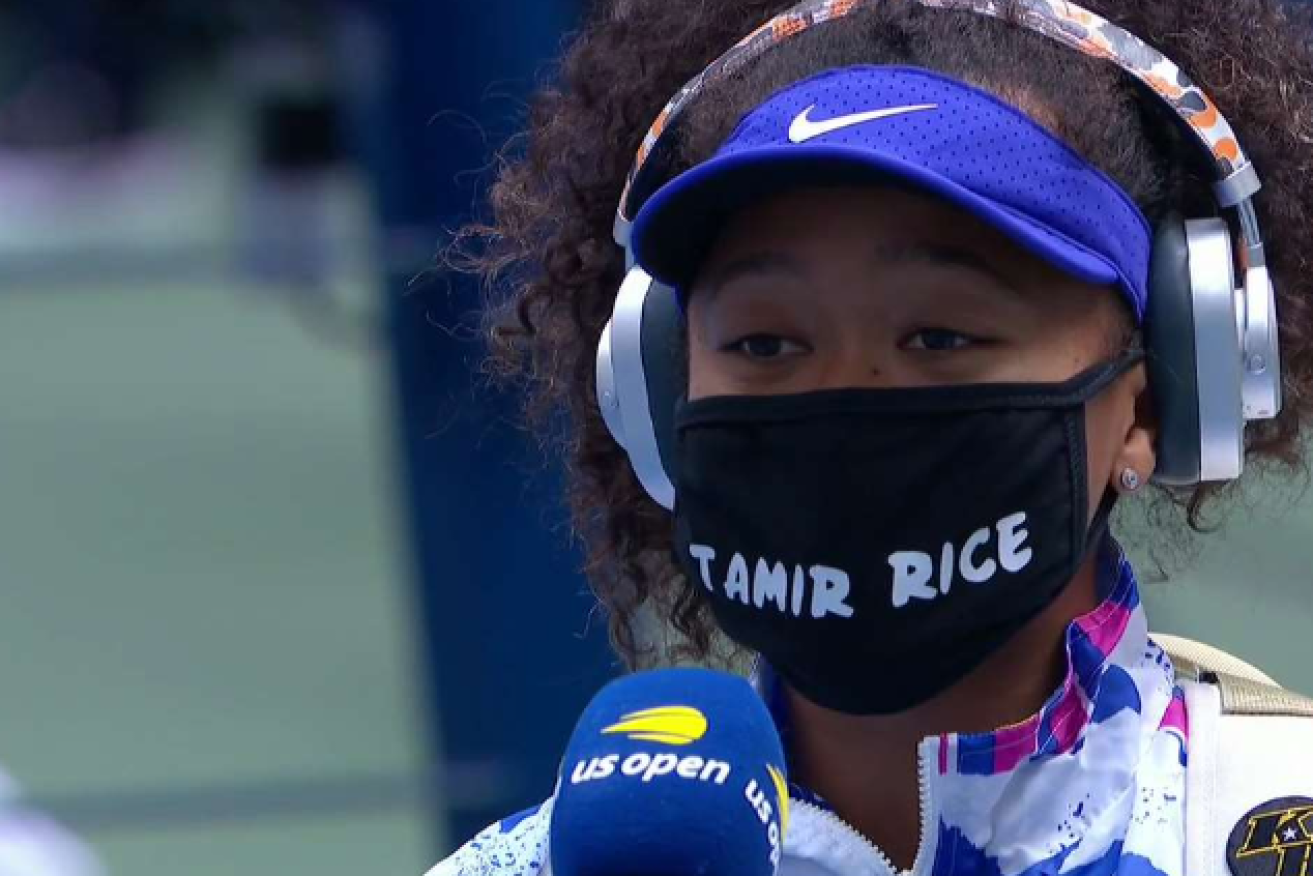 Naomi Osaka puts her activism front and center with the name of a police shooting victim on her mask.