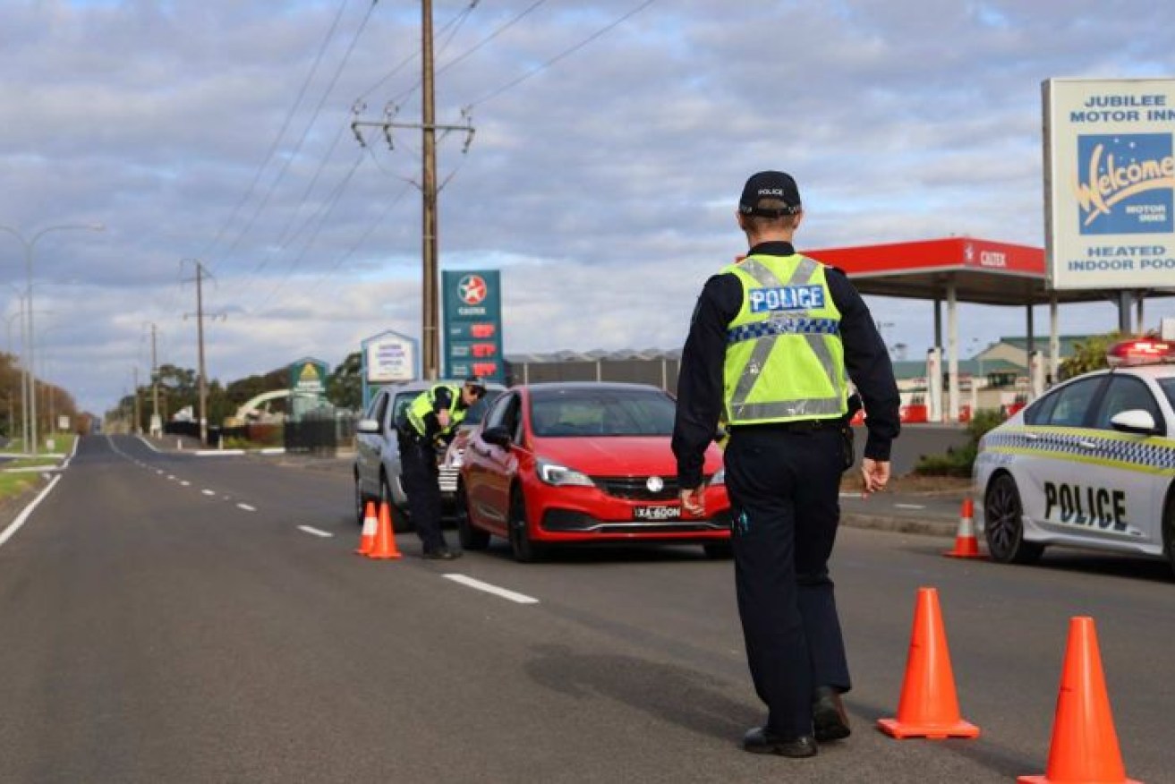 Police speak to drivers at a border checkpoint at Mount Gambier.