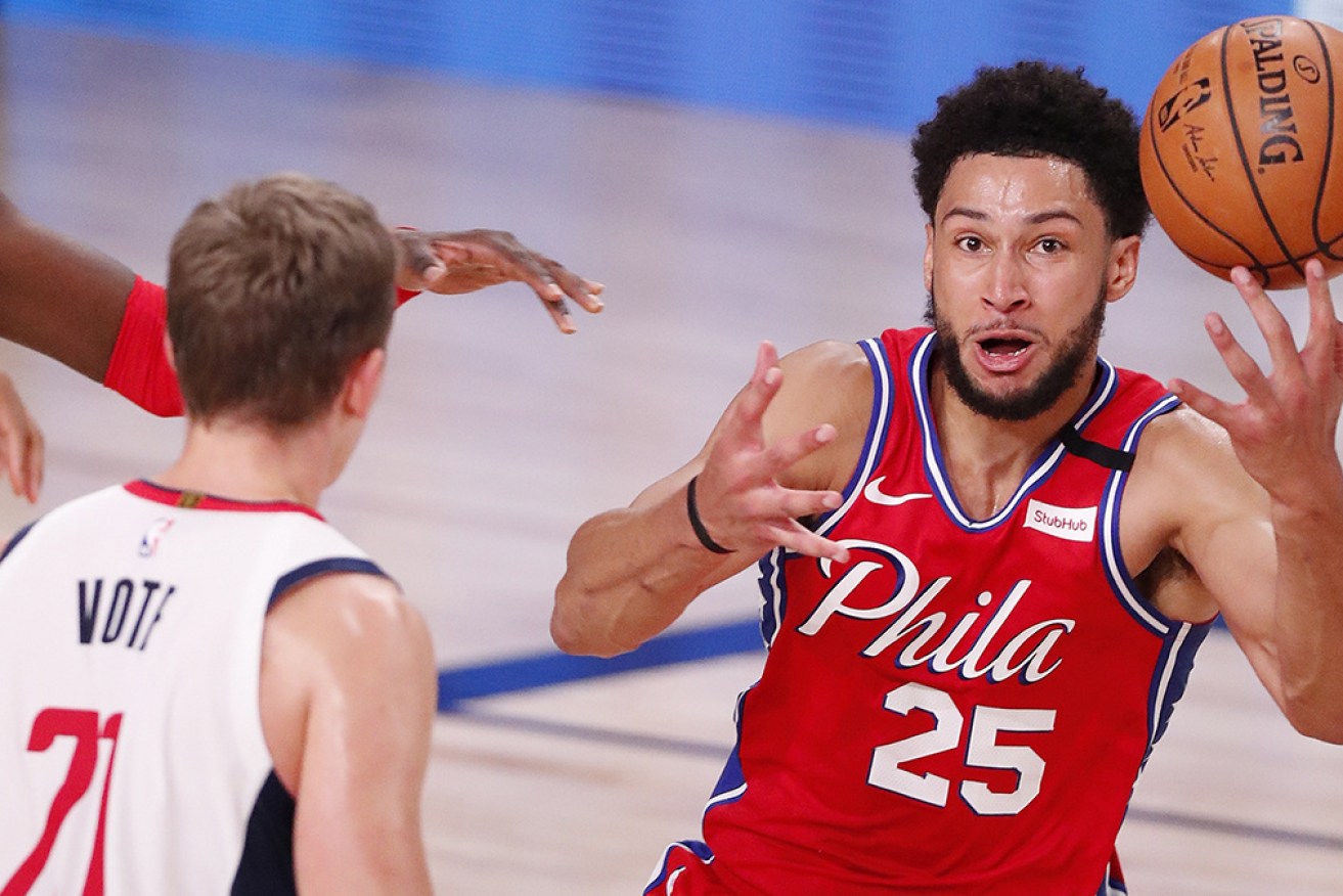 Philadelphia 76ers Ben Simmons grabs a loose ball against Washington Wizards.