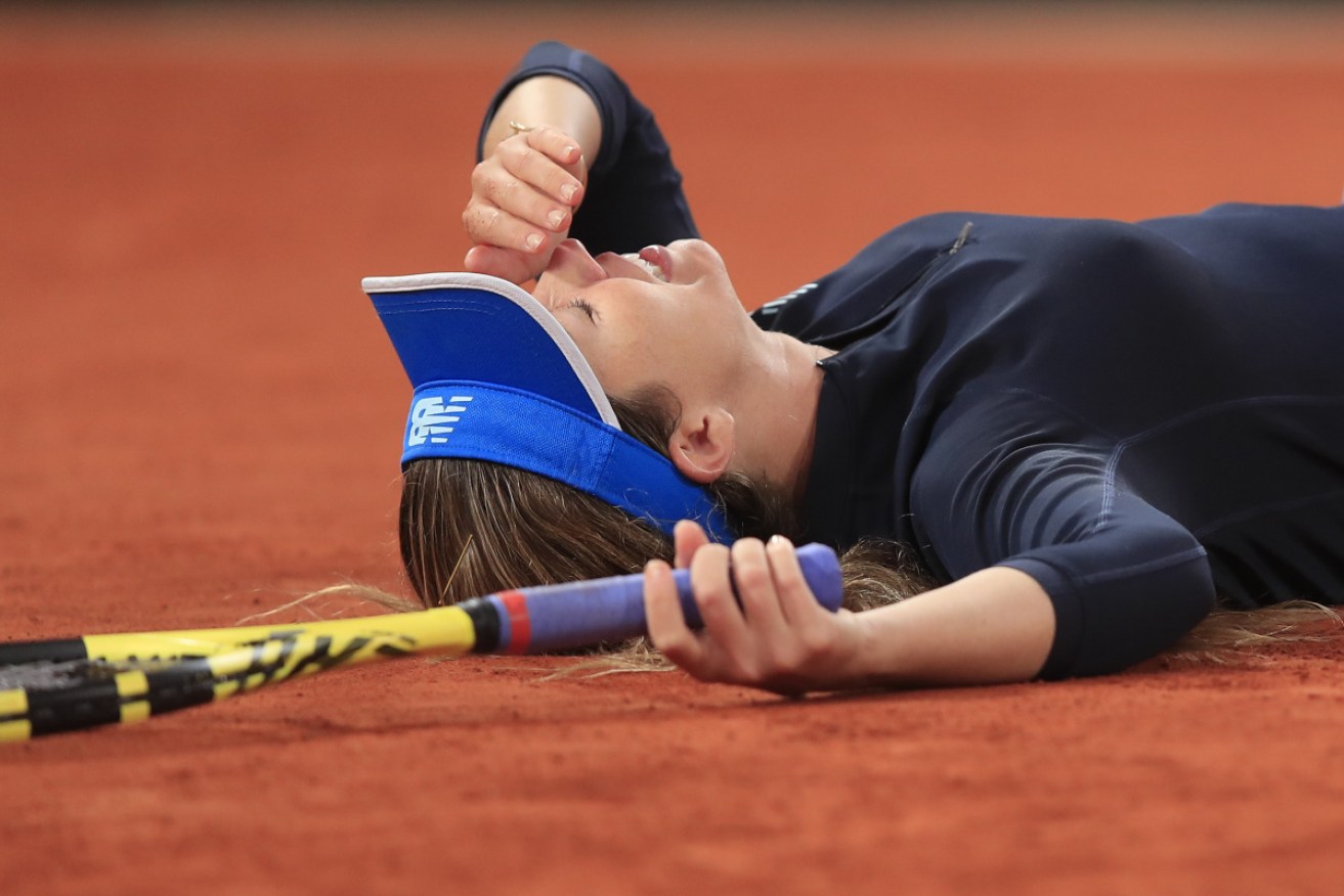 Danielle Collins is floored after her French Open fourth-round win over Tunisia's Ons Jabeur at Roland Garros on Tuesday.