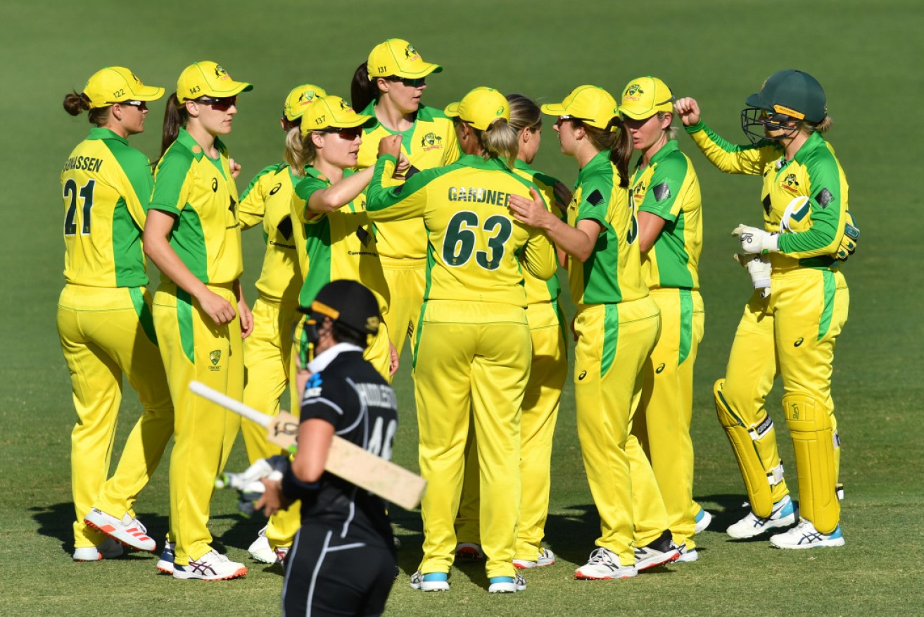 The Australian side celebrates after winning the third ODI against New Zealand in Brisbane on Wednesday. 