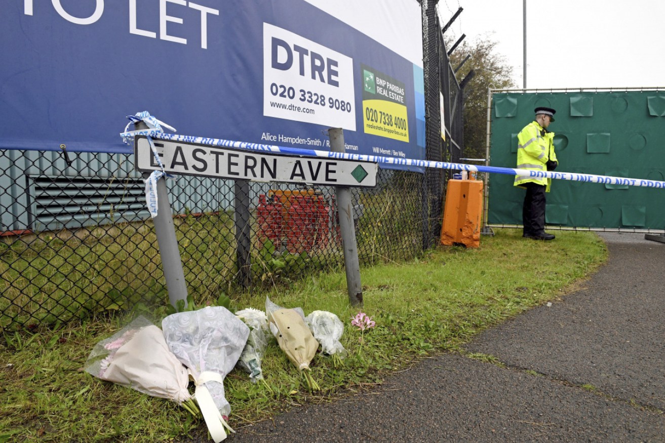 Floral tributes at the Waterglade Industrial Park in Essex in October, the day after 39 bodies were found inside a truck.