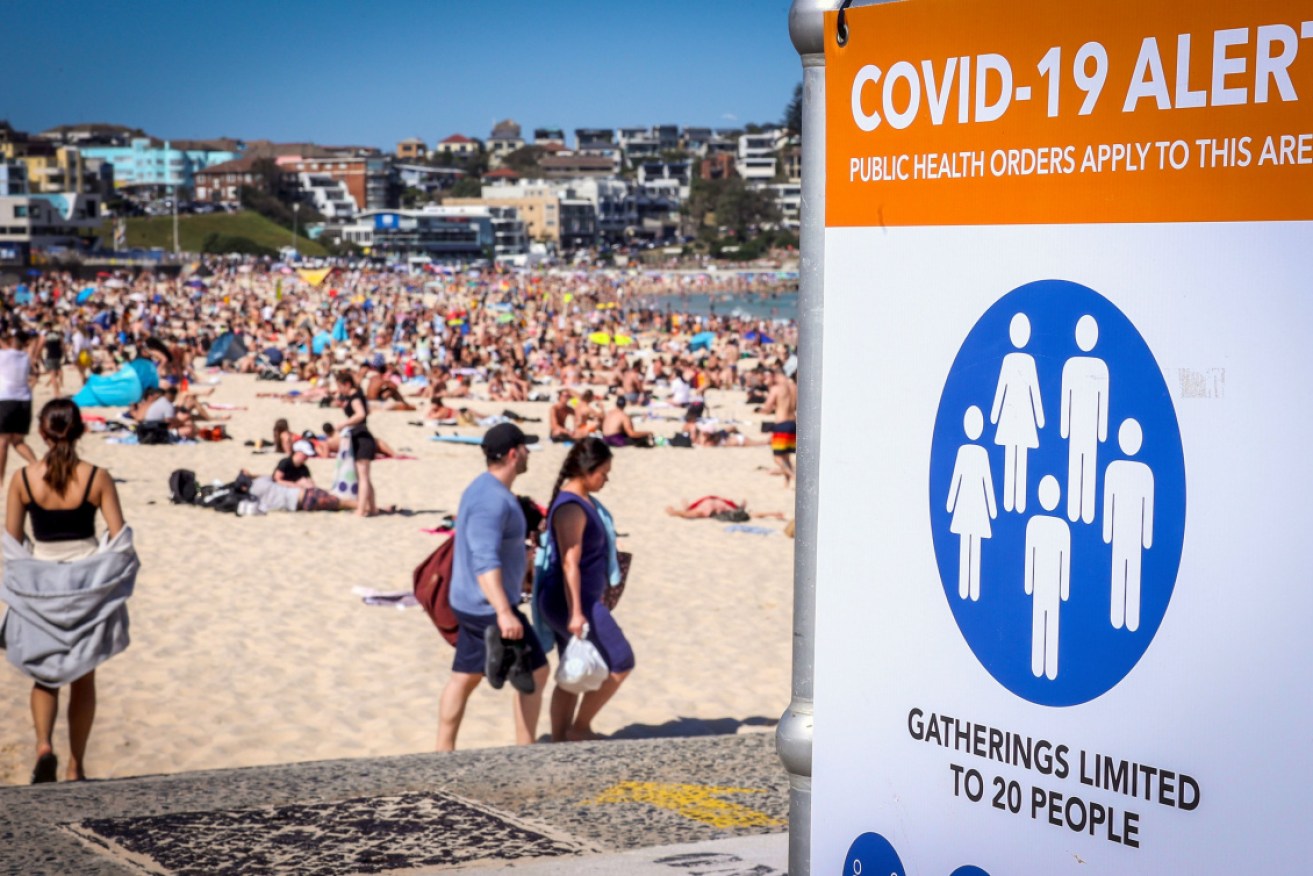 Crowds flocked to Bondi beach on Monday – in warm weather and on a public holiday – sparking fears of more COVID cases.