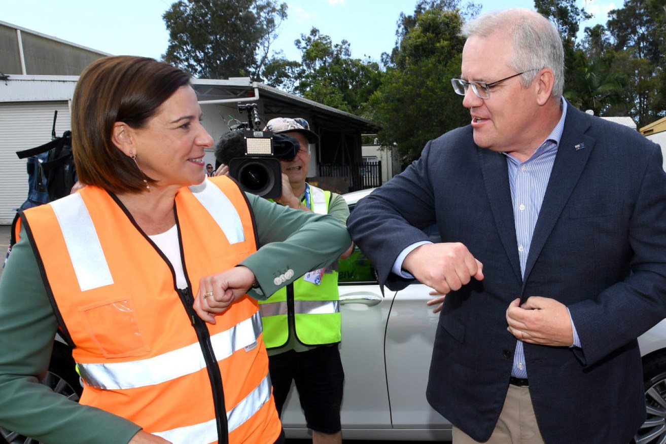 Prime Minister Scott Morrison elbow-bumping LNP opposition leader Deb Frecklington on October 11.