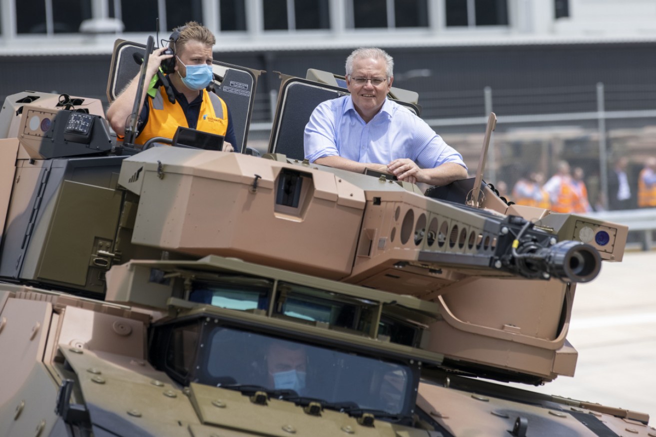 Scott Morrison takes a ride in an armoured vehicle. 