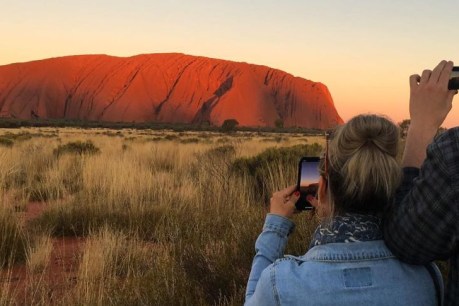 NSW man Otonye Lawson pleads guilty to illegally crossing NT border to take photos of Uluru