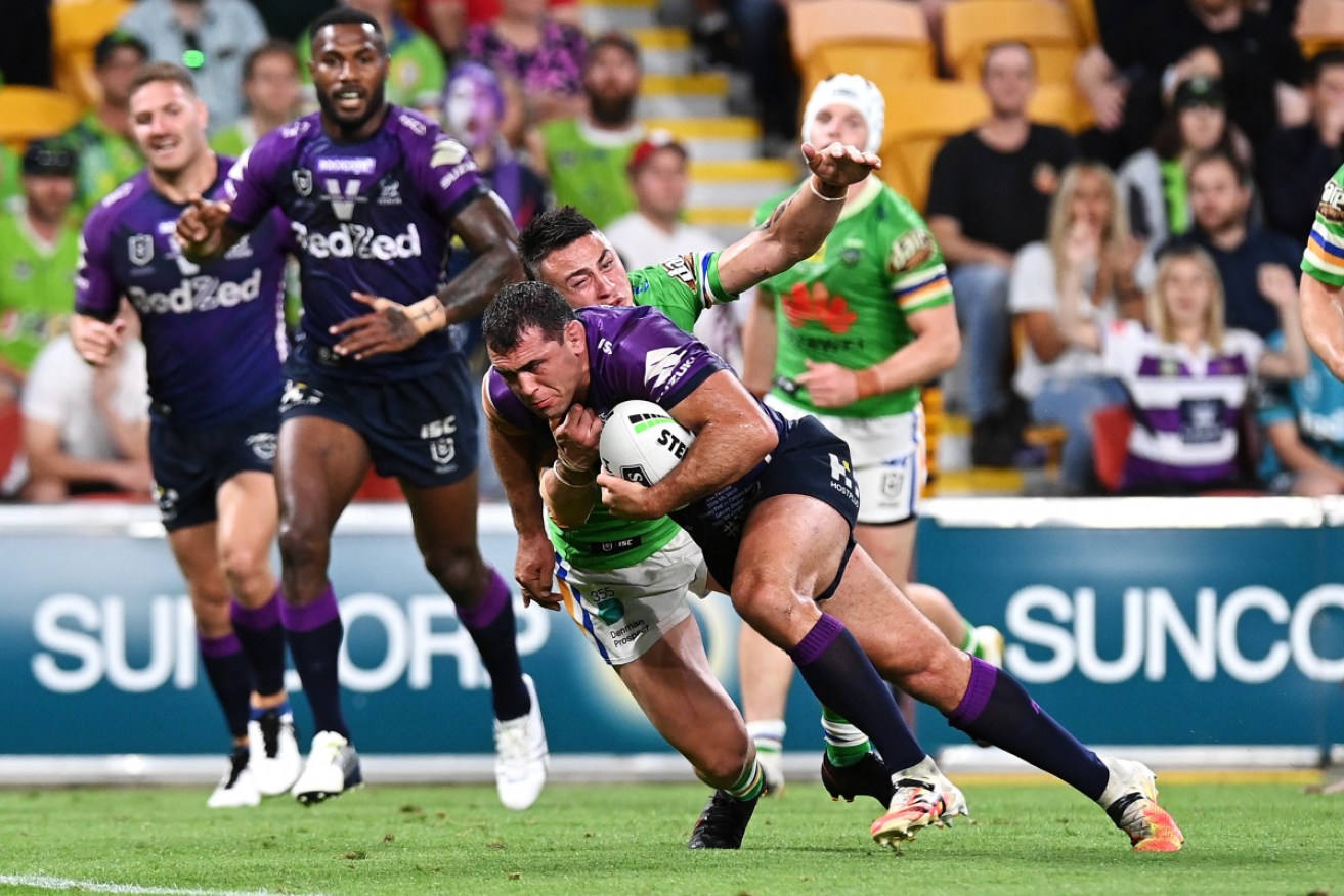 Storm's Dale Finucane on his way to scoring a try against the Raiders.