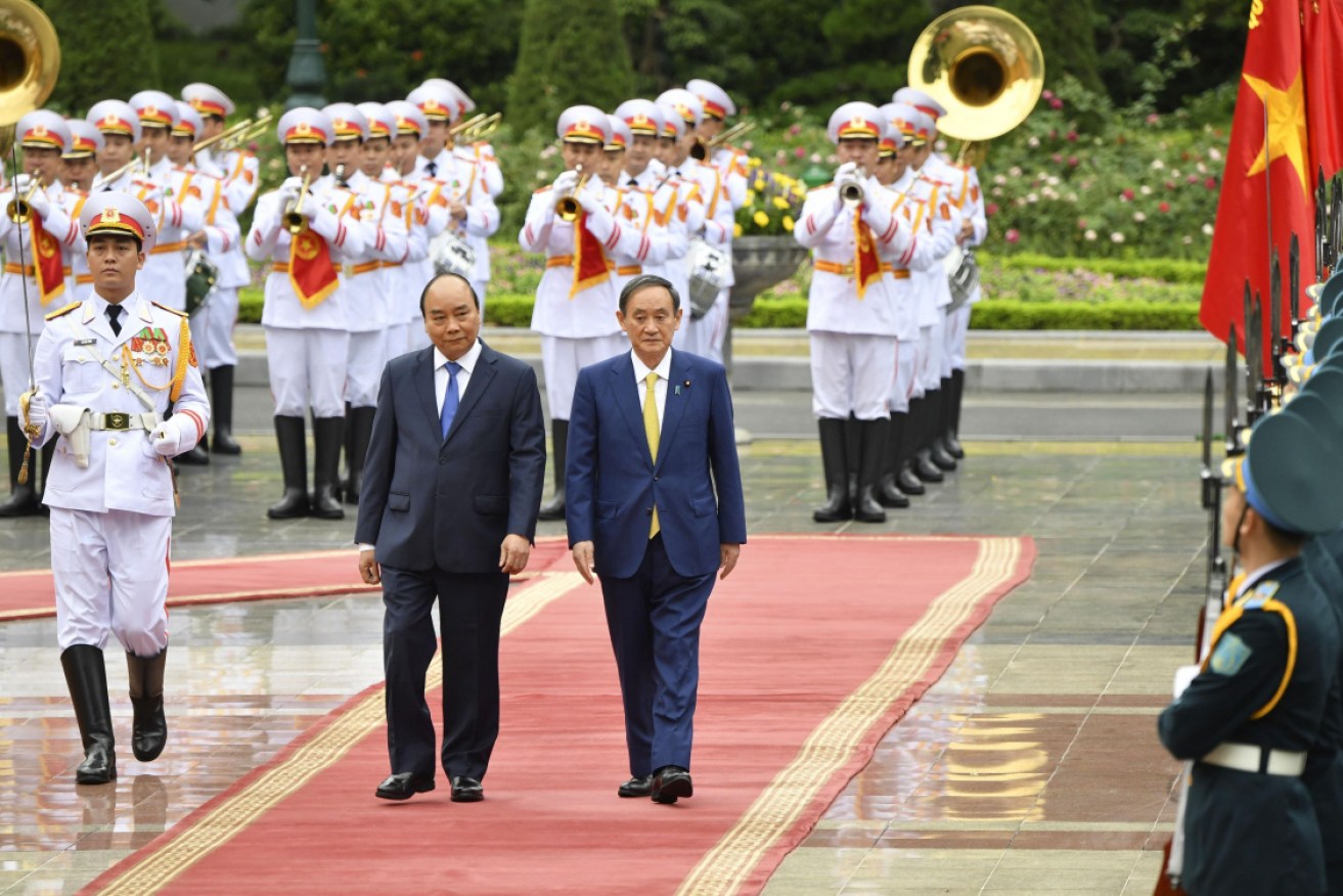 Closer ties: Japanese Prime Minister Yoshihide Suga (R), alongside Vietnamese Prime Minister Nguyen Xuan Phuc.