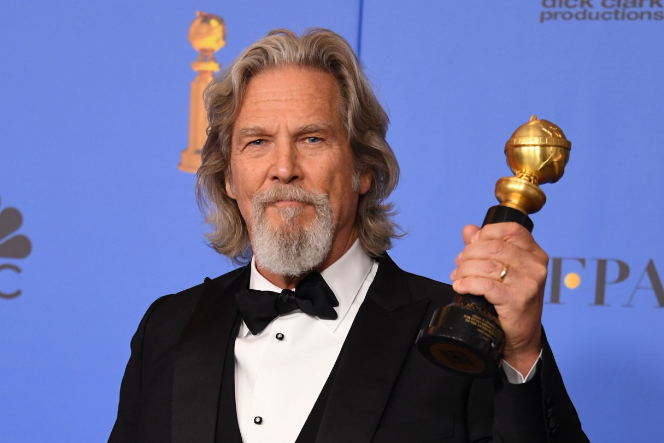 Jeff Bridges with his 2019 Cecil B. DeMille Golden Globe award.