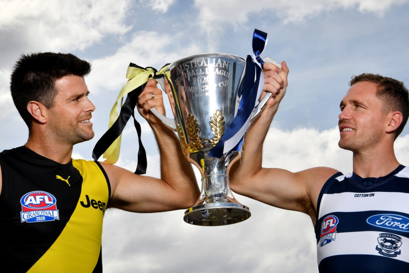 Richmond's Trent Cotchin and Geelong's Joel Selwood with the AFL premiership Cup on Friday. 