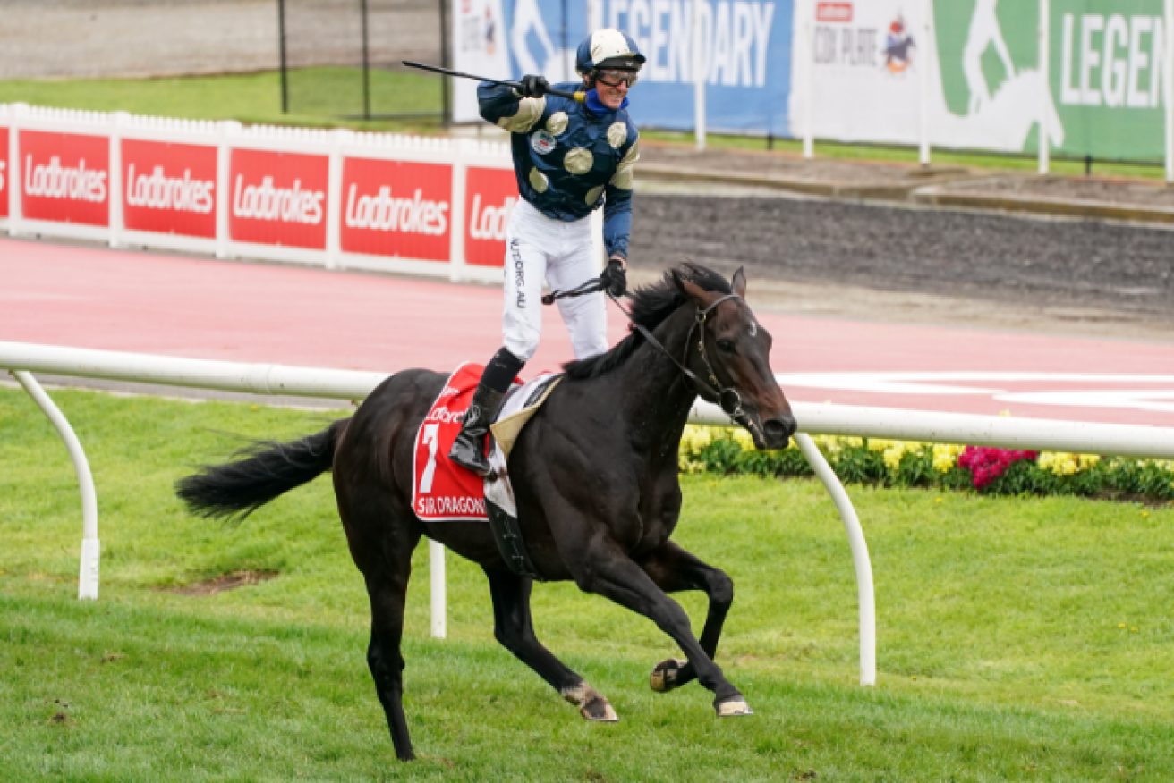 Glen Boss stands high in the stirrups after his big win - a celebration that cost him a $1000 fine. 