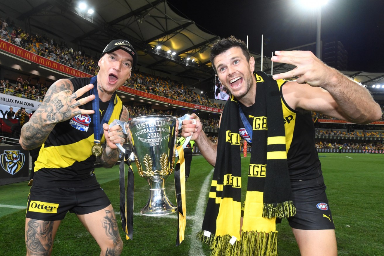 Tiger tough: Dustin Martin (L) and Trent Cotchin with the spoils of victory. 