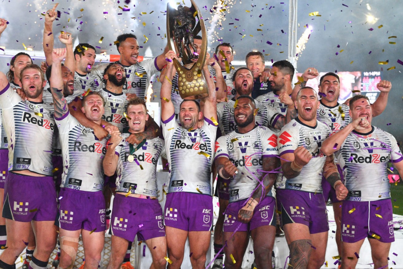 What next? Melbourne Storm, led by Cameron Smith, enjoys the spoils of victory in 2020. 
