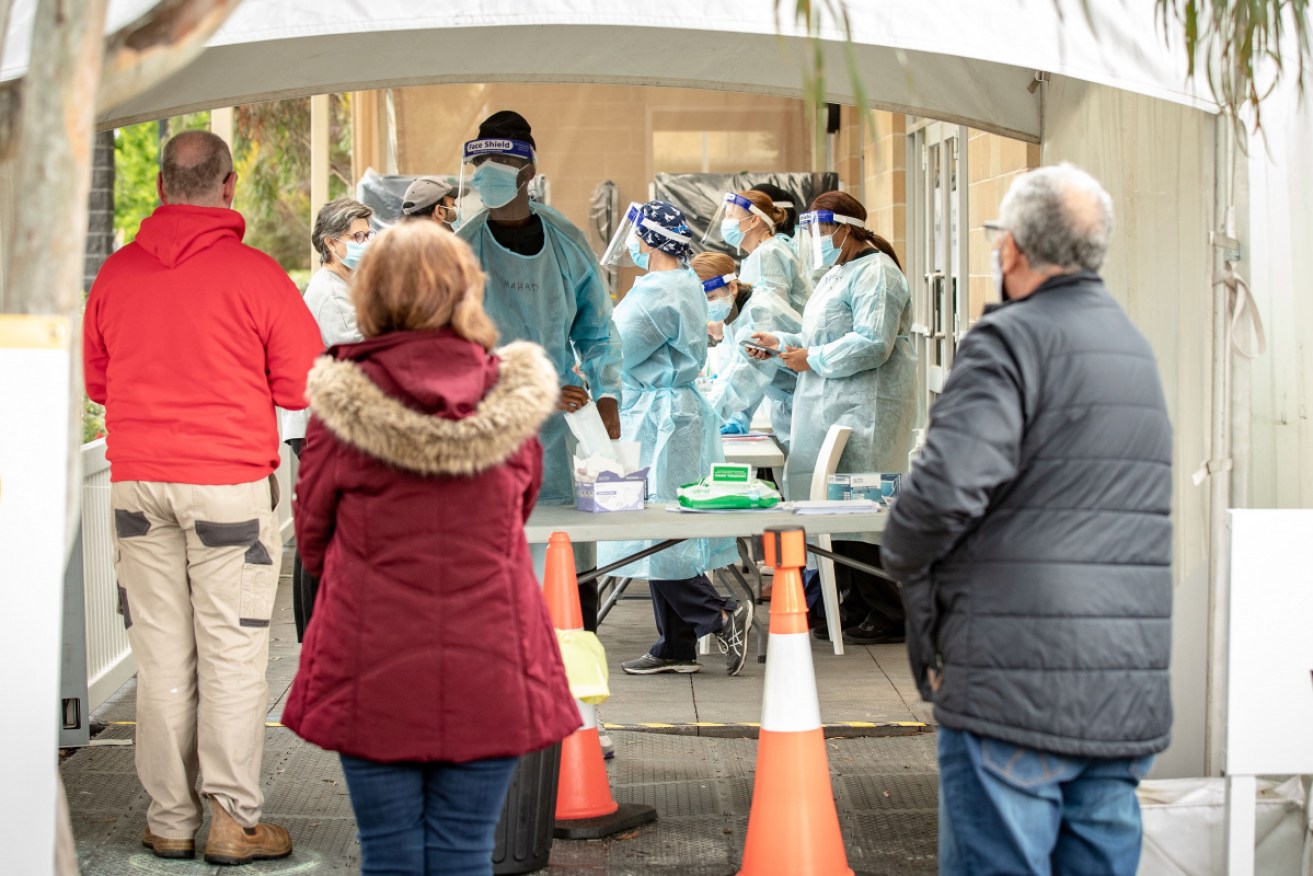 Melburnians queue for virus testing amid a blitz in the city's north.