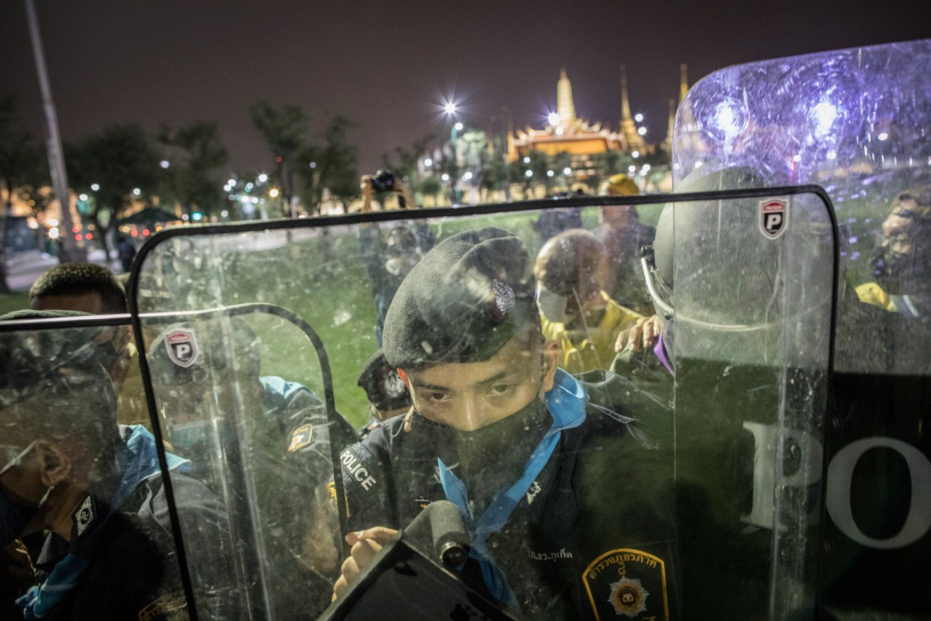 A riot policeman seen behind his shield in front of the Grand Palace during an anti-government demonstration in Bangkok. 