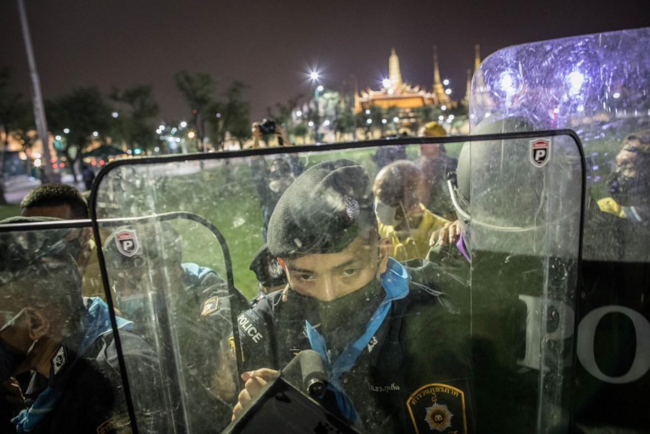 A riot policeman seen behind his shield in front of the Grand Palace during an anti-government demonstration in Bangkok.