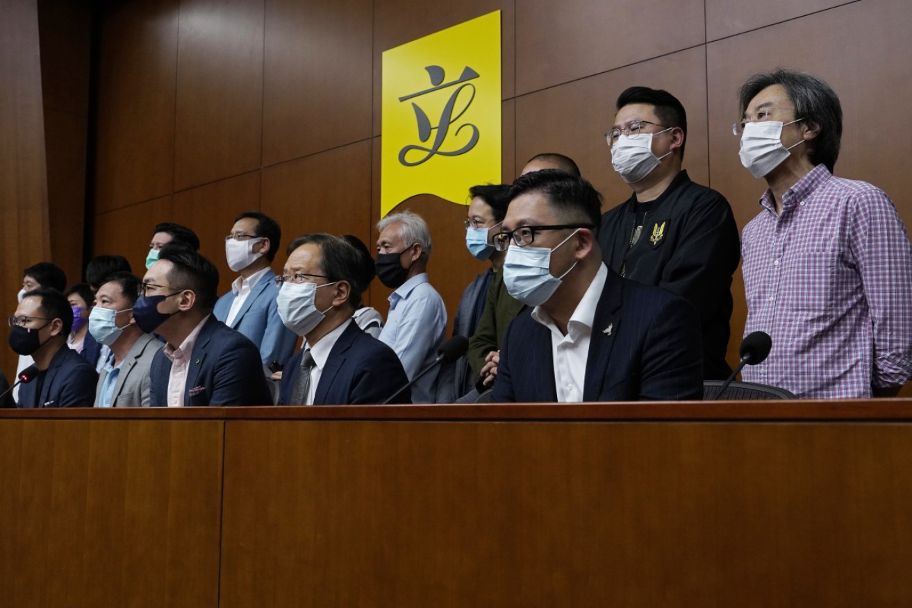Hong Kong's pro-democracy legislators said on Monday they would resign en masse if Beijing disqualifies any of them. 