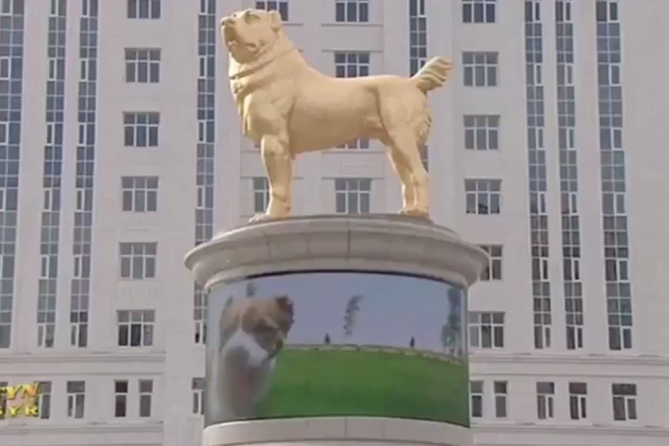 The leader of Turkmenistan unveils a gilded dog statue. 
