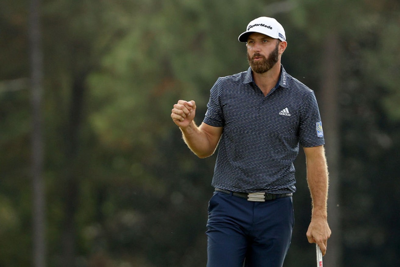 America's Dustin Johnson celebrates on the 18th green after winning the Masters at Augusta National Golf Club.