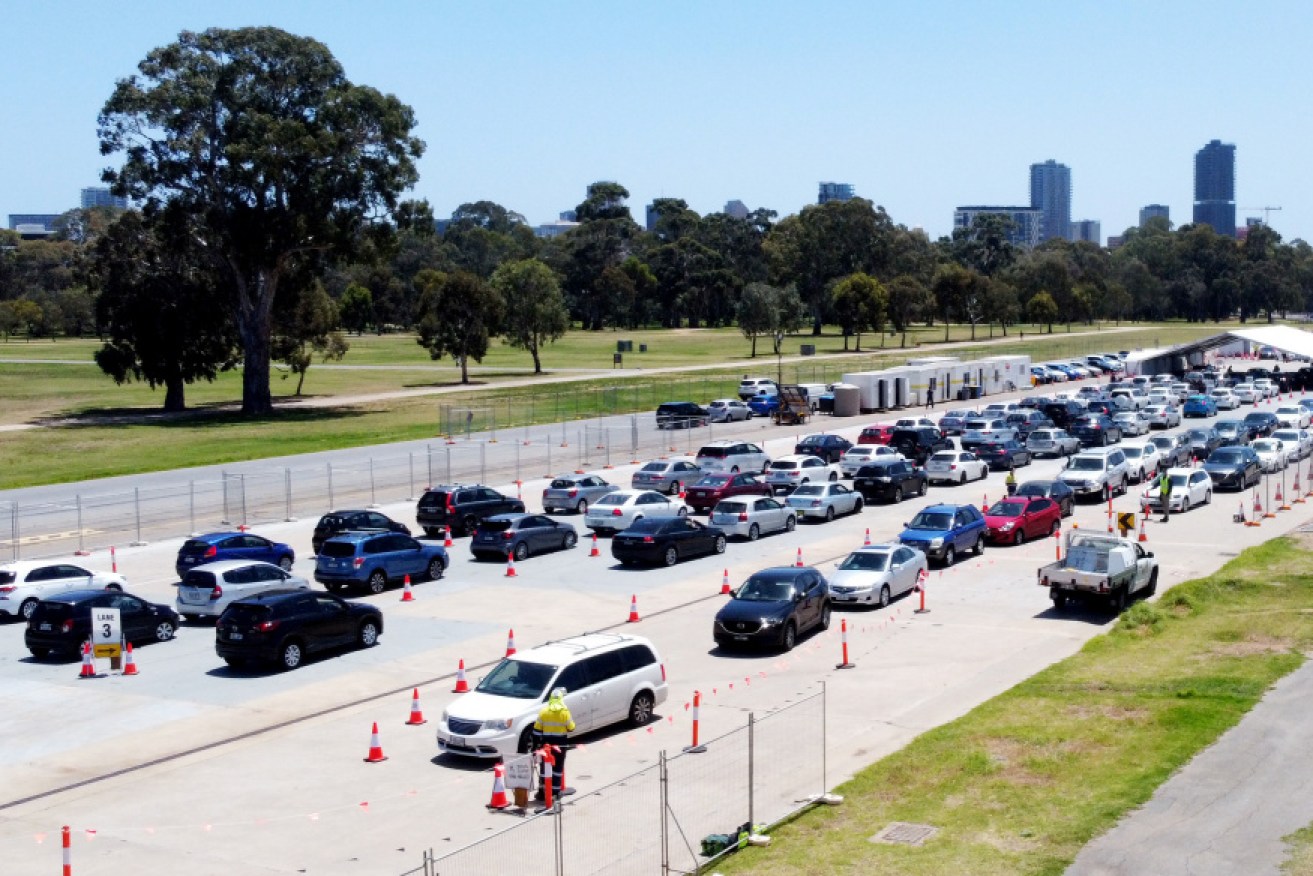 Thousands queued up at testing stations in Adelaide on Tuesday morning as the state prepared to impose restrictions.