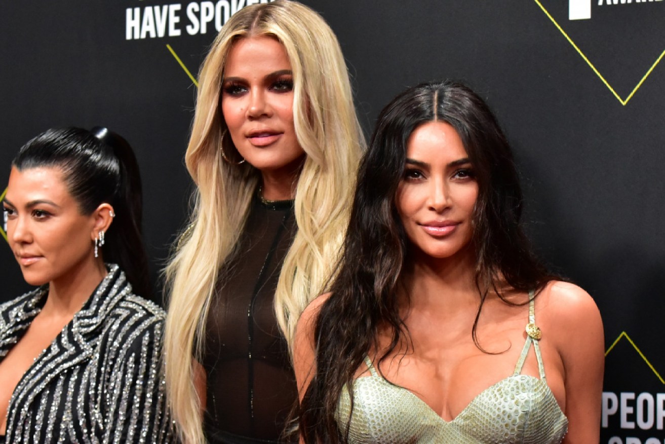 Khloe and Kim Kardashian (centre and right) have used social media posts to try and sell medication.