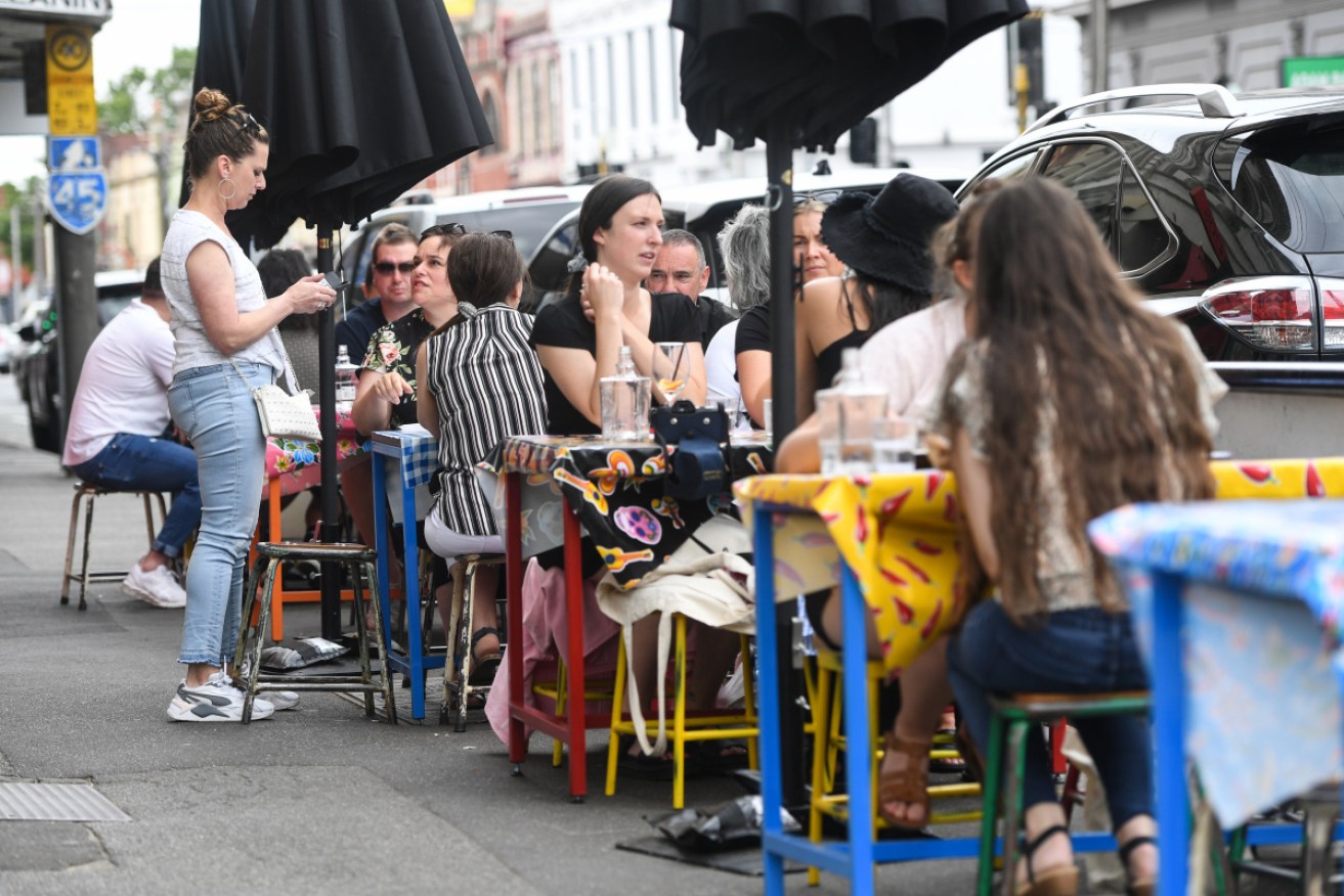 Diners enjoy a street-side meal in Melbourne's inner-city Fitzroy.