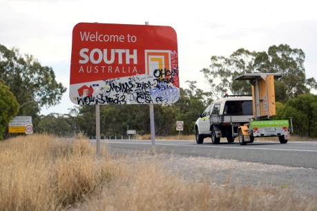 Victoria shuts border with SA, NSW to ease up for NYE