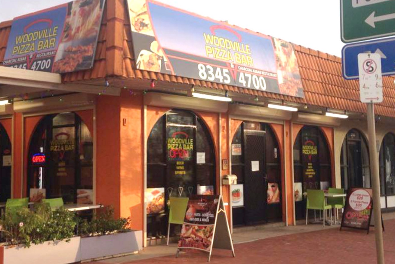 Authorities say a high school student contracted COVID when picking up a pizza.