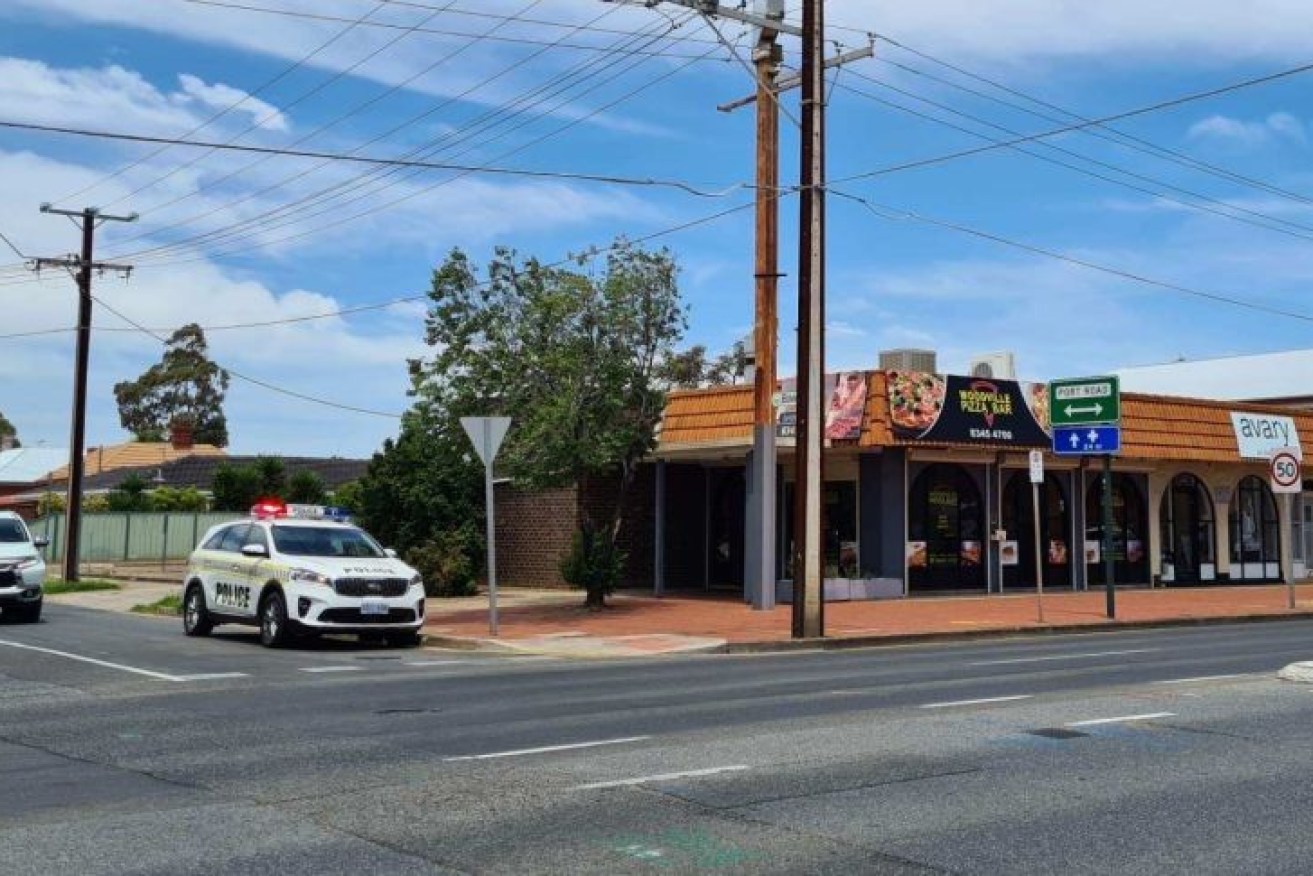 Police outside the Woodville Pizza Bar in Adelaide's north-west.