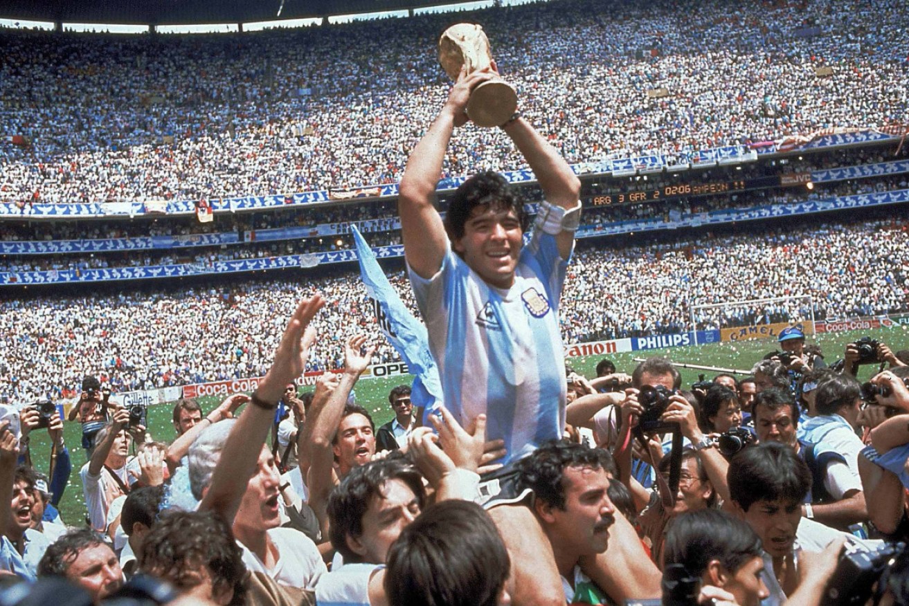 Diego Maradona with the 1986 World Cup trophy.